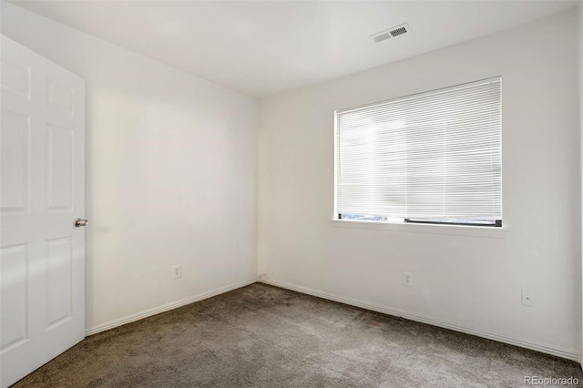 2237 S Buckley Rd Unit 101, Aurora, CO 80013 - empty room featuring carpet and baseboards