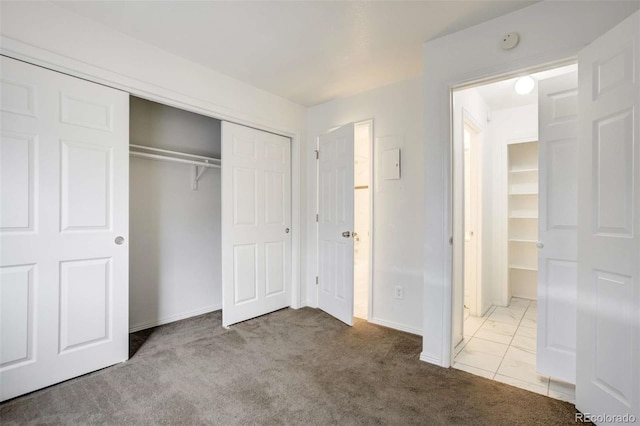 2237 S Buckley Rd Unit 101, Aurora, CO 80013 - unfurnished bedroom featuring carpet flooring and a closet