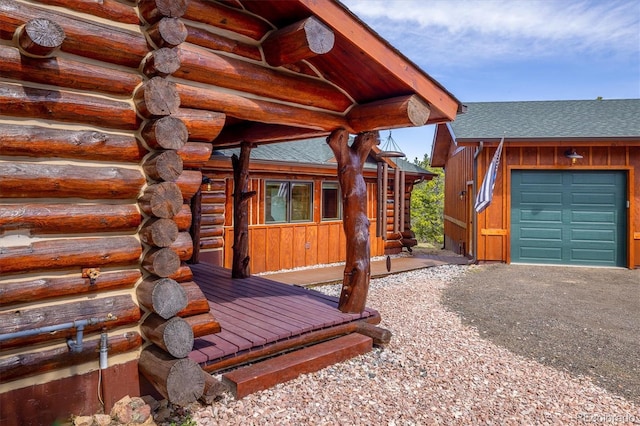 view of exterior entry featuring a garage