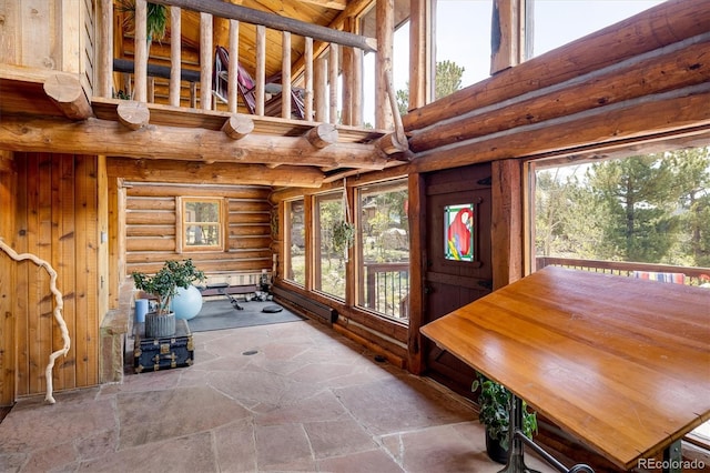 unfurnished sunroom featuring a wealth of natural light