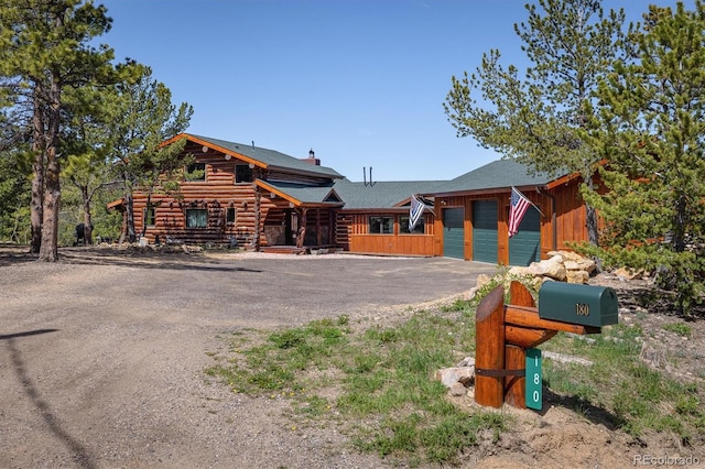 log home with a garage