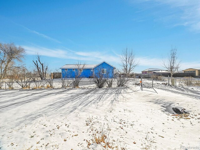 view of yard layered in snow