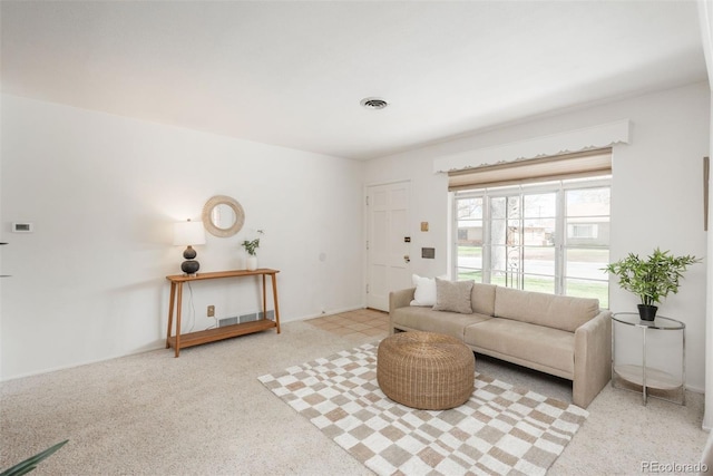 living room featuring visible vents