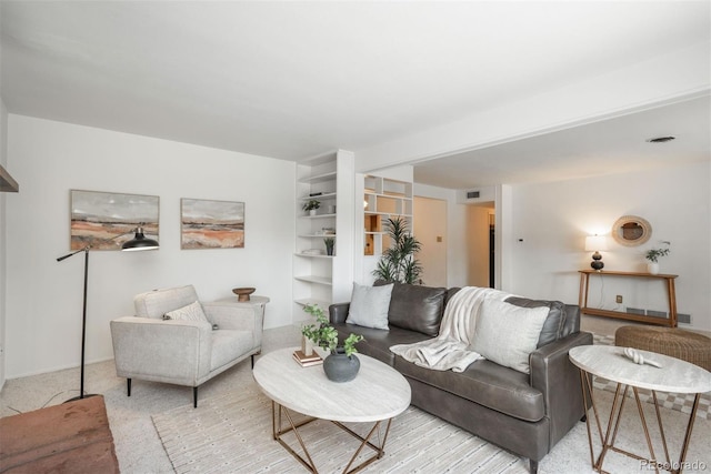 carpeted living room with visible vents
