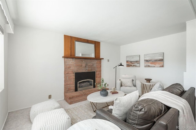carpeted living area with a fireplace