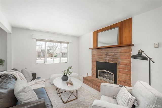 living area with a brick fireplace