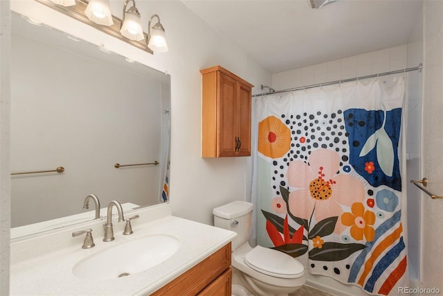 bathroom with vanity, toilet, and curtained shower