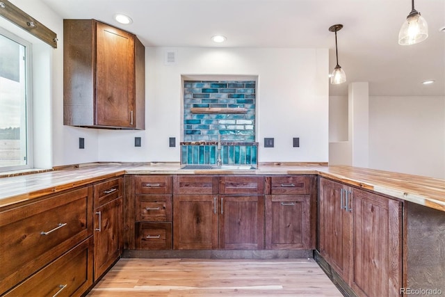 40192 Margaret Dr, Elizabeth, CO 80107 - kitchen with light wood-style floors, pendant lighting, recessed lighting, and butcher block counters