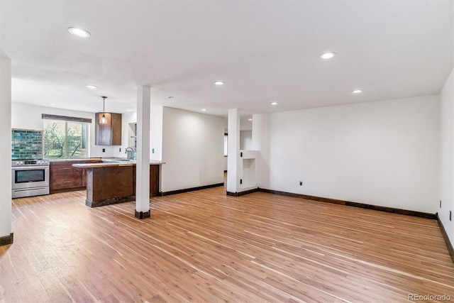 40192 Margaret Dr, Elizabeth, CO 80107 - unfurnished living room featuring light wood-style floors and recessed lighting
