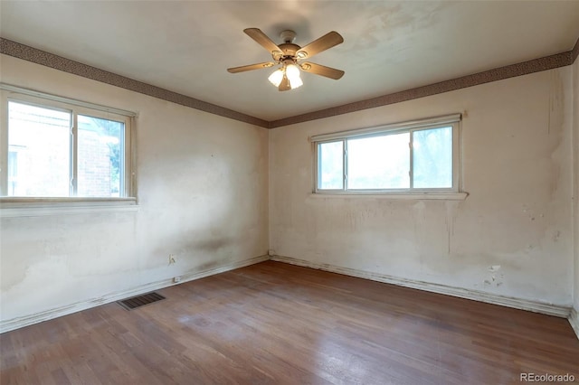 1335 Locust St, Denver, CO 80220 - unfurnished room featuring wood finished floors and a ceiling fan