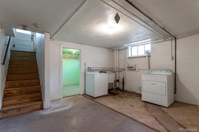 1335 Locust St, Denver, CO 80220 - basement featuring washing machine and clothes dryer and stairway