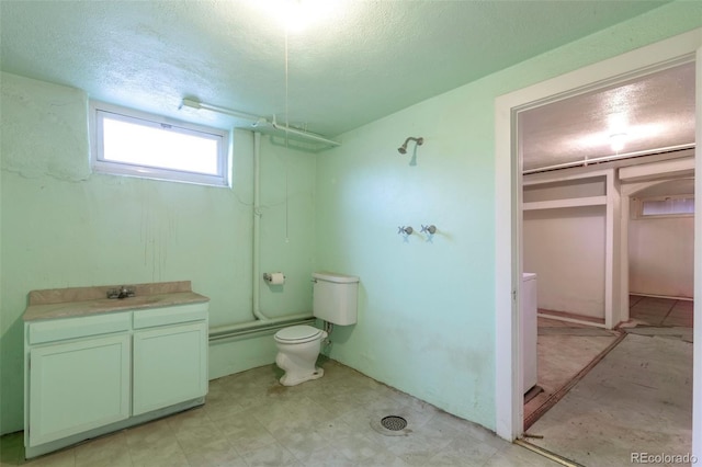 1335 Locust St, Denver, CO 80220 - bathroom featuring  shower combination, a textured ceiling, and vanity