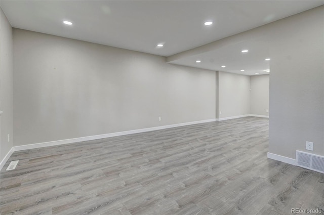 spare room featuring light hardwood / wood-style flooring