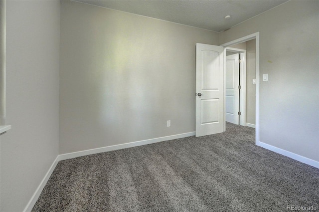 unfurnished room with carpet