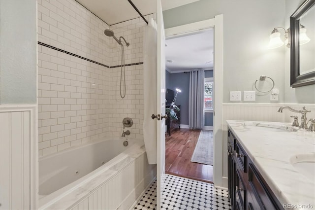 bathroom with vanity and tiled shower / bath combo