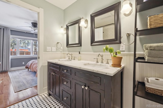 bathroom with hardwood / wood-style flooring, vanity, and ceiling fan