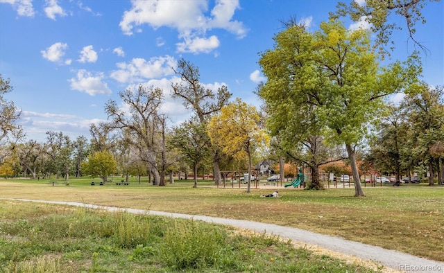 view of home's community with a yard