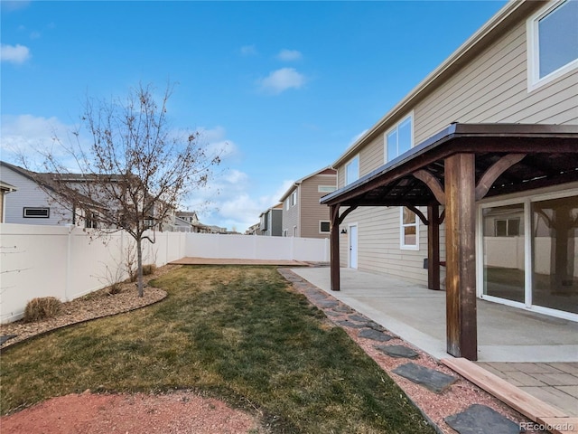 view of yard featuring a gazebo, a patio area, and a fenced backyard