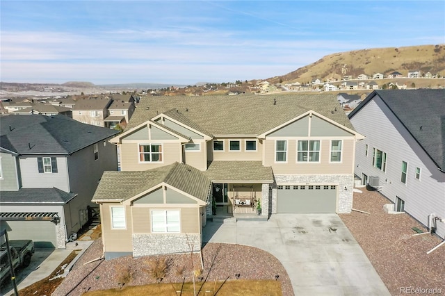 view of front of house with a garage and a mountain view