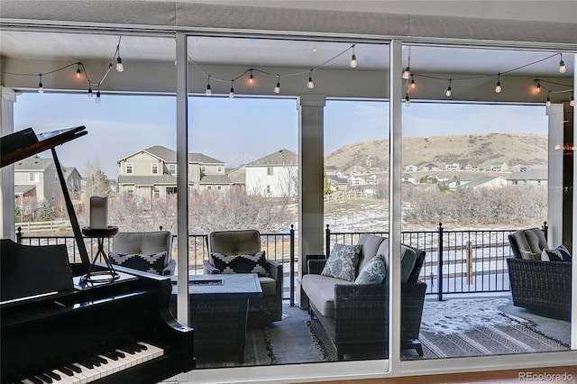 interior space featuring a mountain view and an outdoor hangout area