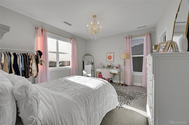 carpeted bedroom with a chandelier and multiple windows