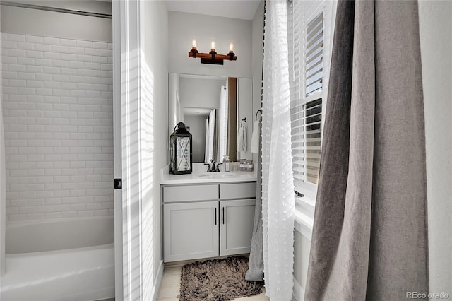 bathroom with shower / bathtub combination with curtain and vanity