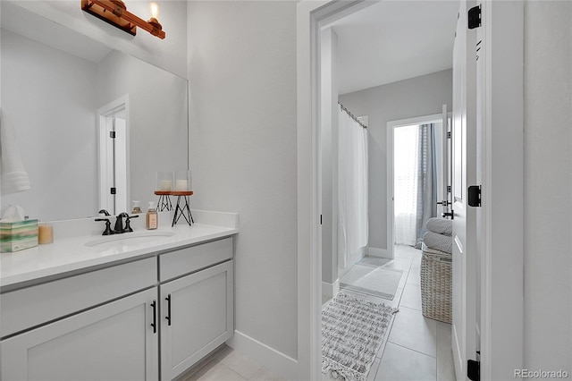 bathroom with vanity and tile patterned flooring