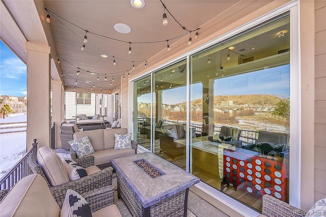 sunroom featuring a mountain view