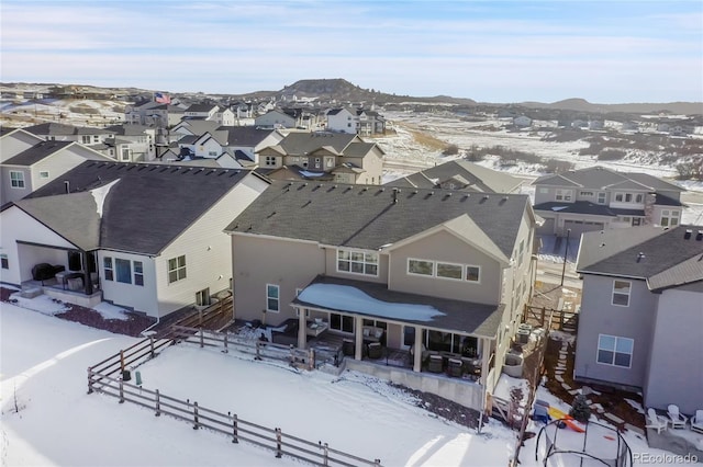 snowy aerial view with a mountain view