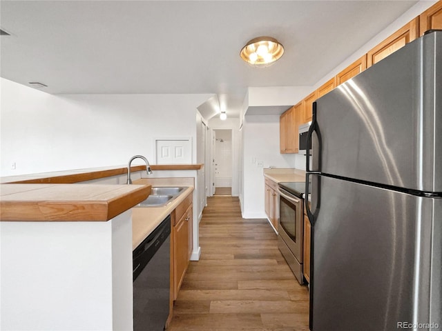 5550 W 80th Pl Unit 20, Arvada, CO 80003 - kitchen featuring stainless steel appliances, wood finished floors, and light countertops