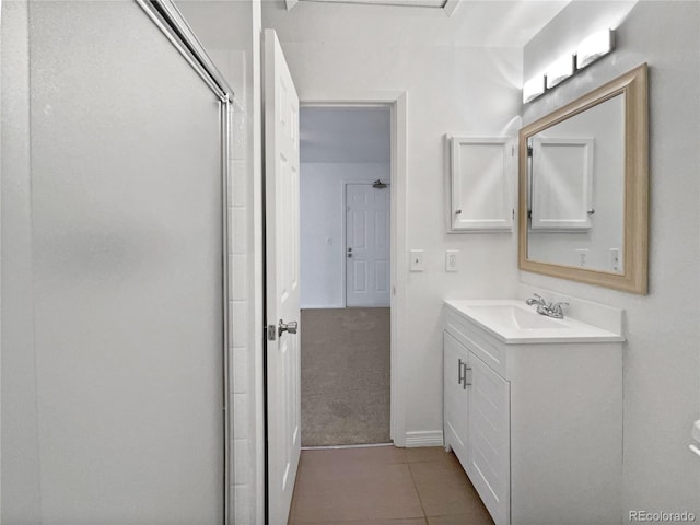 5550 W 80th Pl Unit 20, Arvada, CO 80003 - full bathroom with vanity, a shower with door, and tile patterned floors