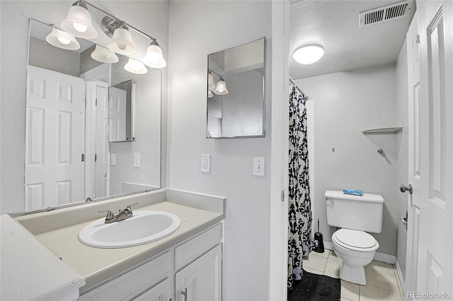 bathroom with toilet, a shower with curtain, vanity, and tile patterned floors