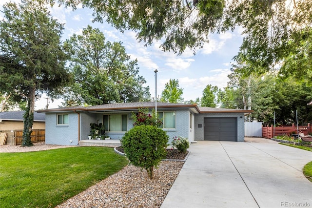 7650 W 24th Ave, Lakewood, CO 80214 - ranch-style house featuring a garage, concrete driveway, and brick siding