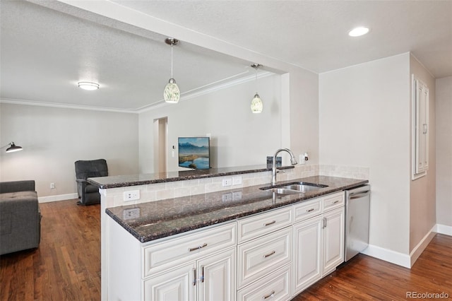 7650 W 24th Ave, Lakewood, CO 80214 - kitchen featuring open floor plan, stainless steel dishwasher, dark wood-style flooring, a peninsula, and dark stone counters