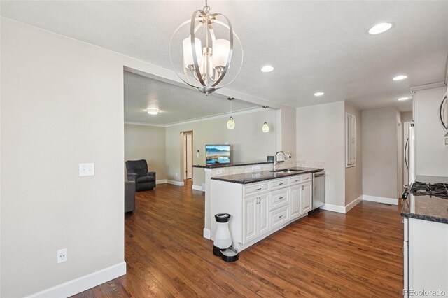 7650 W 24th Ave, Lakewood, CO 80214 - kitchen featuring a chandelier, dark wood finished floors, white cabinetry, a peninsula, and recessed lighting