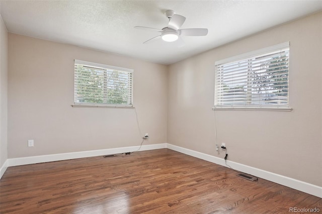 7650 W 24th Ave, Lakewood, CO 80214 - spare room featuring plenty of natural light, wood finished floors, and ceiling fan