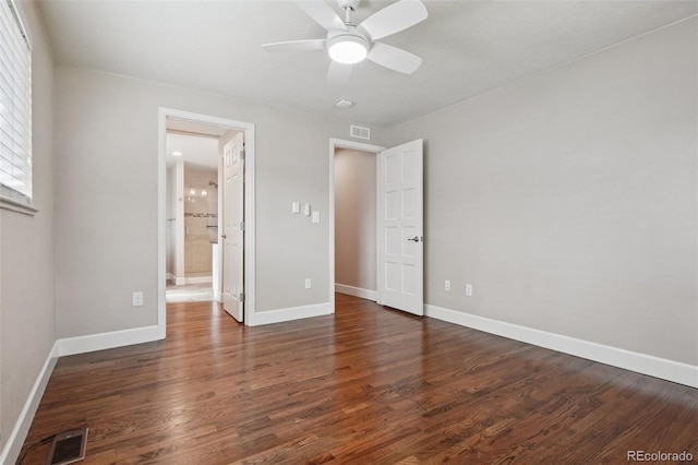 7650 W 24th Ave, Lakewood, CO 80214 - unfurnished bedroom with wood finished floors, ceiling fan, and ensuite bath