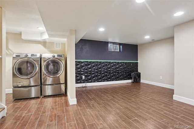 7650 W 24th Ave, Lakewood, CO 80214 - laundry room with wood finished floors, an accent wall, recessed lighting, and separate washer and dryer