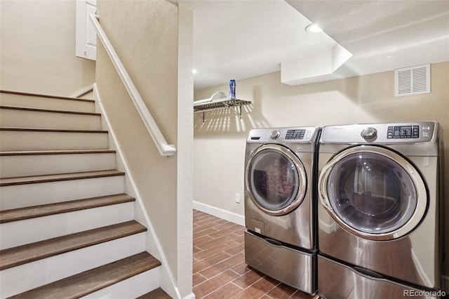 7650 W 24th Ave, Lakewood, CO 80214 - washroom featuring washing machine and clothes dryer and dark wood-style floors