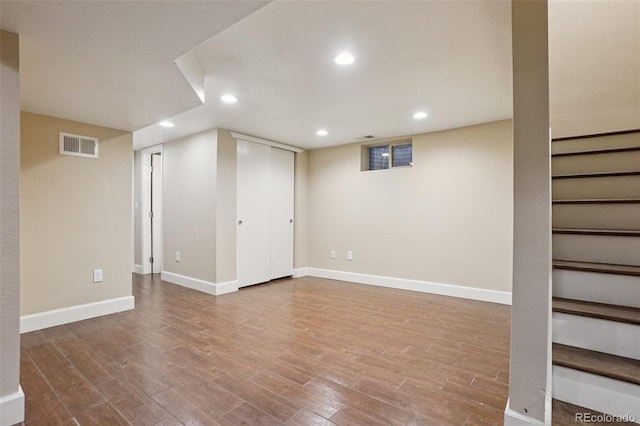 7650 W 24th Ave, Lakewood, CO 80214 - finished basement with wood finished floors, recessed lighting, and stairway
