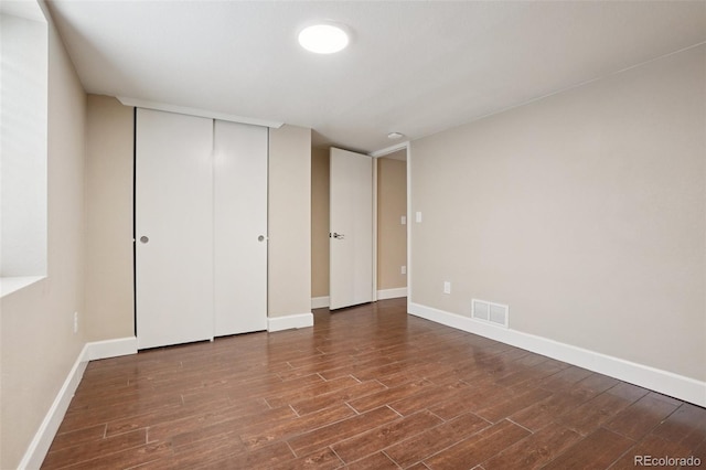 7650 W 24th Ave, Lakewood, CO 80214 - unfurnished bedroom featuring wood finished floors and a closet