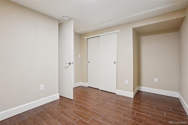 7650 W 24th Ave, Lakewood, CO 80214 - unfurnished bedroom with wood finished floors and a closet