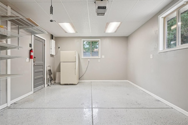 7650 W 24th Ave, Lakewood, CO 80214 - below grade area with freestanding refrigerator and baseboards