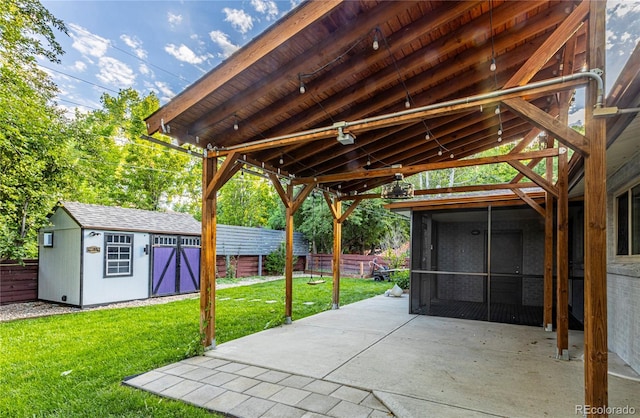 7650 W 24th Ave, Lakewood, CO 80214 - view of patio / terrace with a sunroom and an outdoor structure