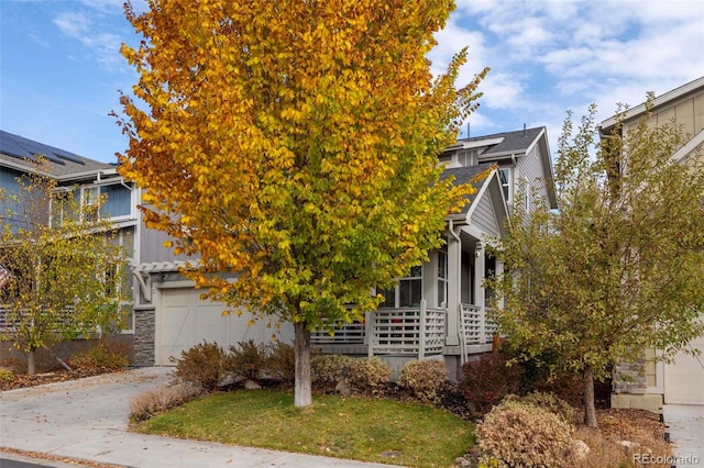 obstructed view of property featuring a garage