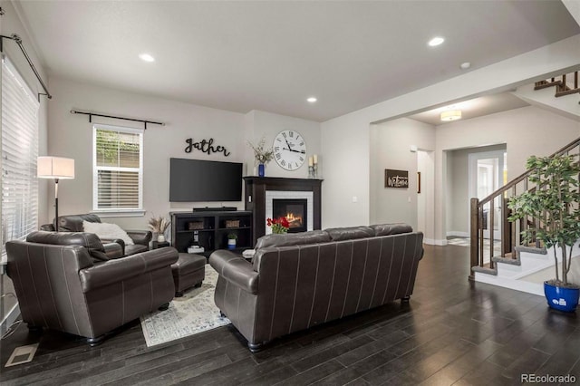 living room with dark hardwood / wood-style flooring