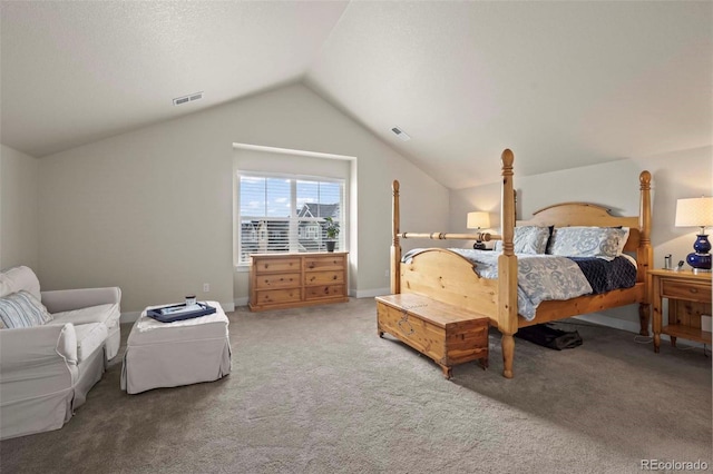 bedroom with carpet flooring and lofted ceiling