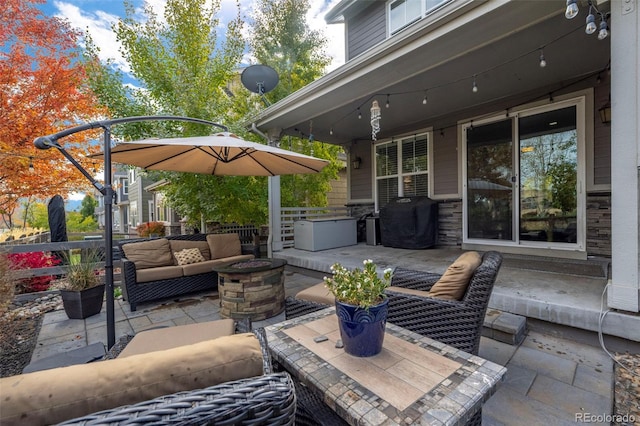 view of patio featuring an outdoor hangout area and a grill