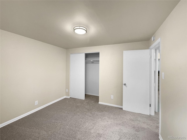 unfurnished bedroom with a closet and carpet