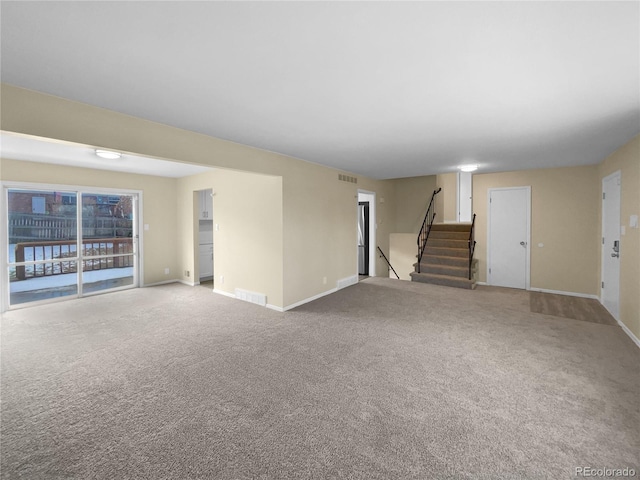 unfurnished living room featuring carpet flooring